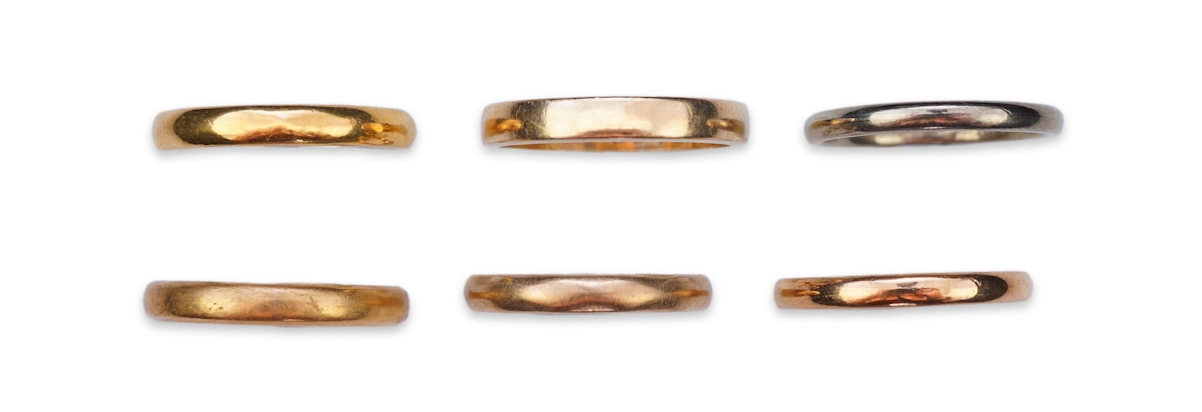 A collection of six gold wedding bands